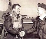K-14, Kimpo, Korea - 1 February 1953. 1st Lt. Ken Collins being congratulated by Maj. Houser Wilson, 15th Tactical Reconnaissance Squadron Commander on Ken's completion of his 100th Combat Mission.