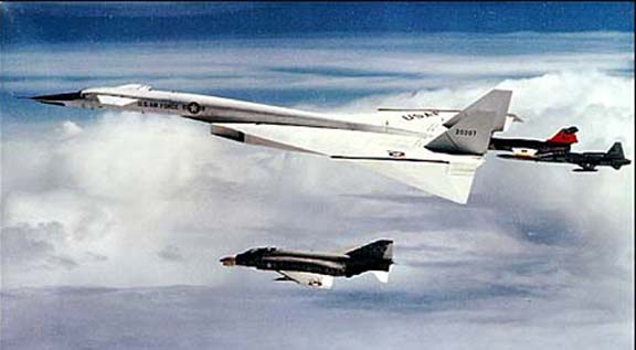 All the planes are in formation for the photo session. This photo taken from the Citation just before midair collision of Joe Walker's F-104N and Al White and Carl Cross's XB-70A.